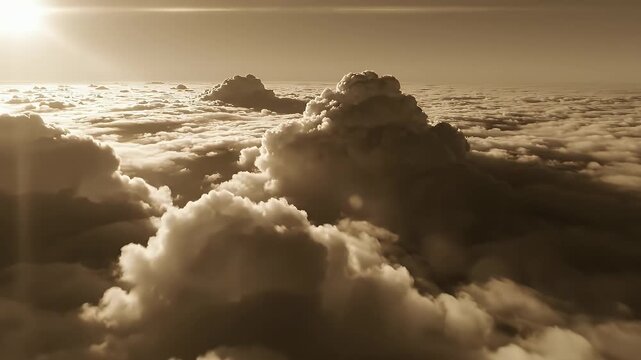 Aerial View of Dramatic Cloudscape - A stunning monochrome aerial shot shows a dramatic cloudscape with dense, billowing clouds stretching across the horizon under a bright, diffused sunlight.