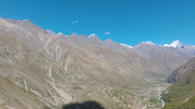Drone reveal shot of kinnaur valley showing chitkul village and baspa river