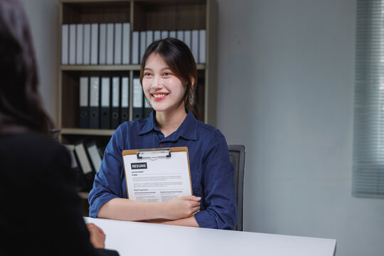 Young asian woman confidently interviewing for a new job