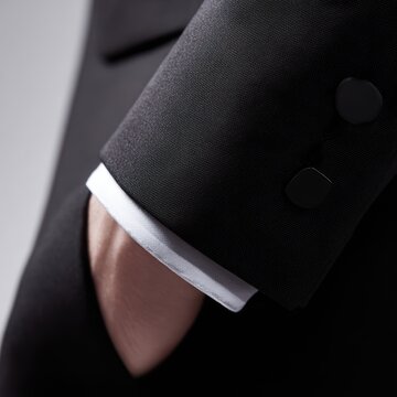 Suit jacket with a discreet NFC payment chip in the cuff, high-tech finance lifestyle
