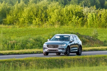 Fototapeta premium Premium crossover vehicle on quiet countryside road