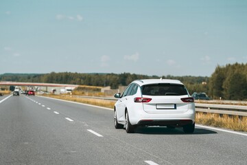 Fototapeta premium Rear view of station wagon on open highway