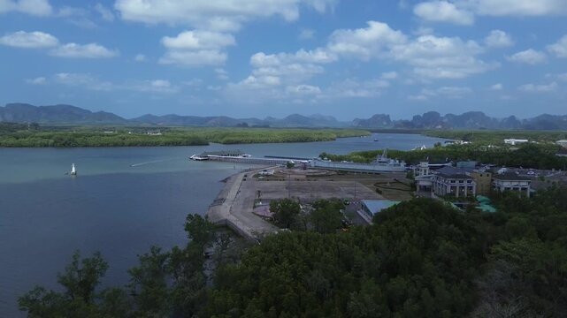 Aerial view of the HTMS Lanta warship museum featuring a decommissioned naval ship and aircraft display near Klong Jilad Ferry Pier in Krabi Thailand coastal area.
Surrounded by stunning nature.
