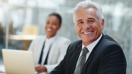 professionals wearing collaborate and talk at a modern office, showing teamwork, communication, and a positive work environment.