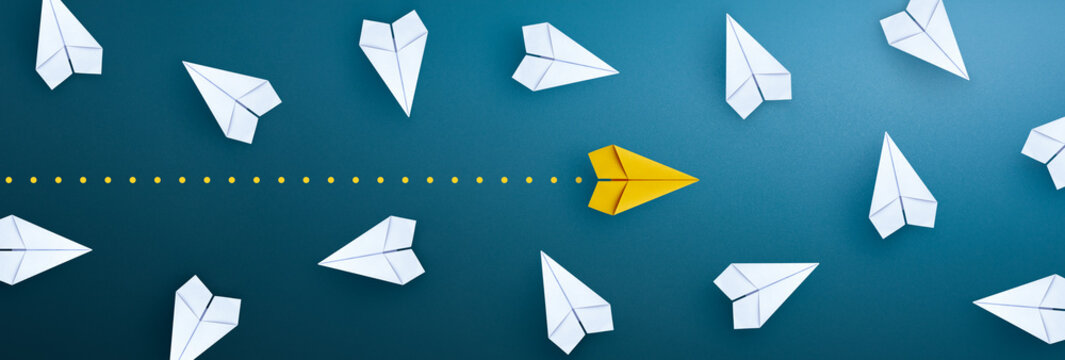 Yellow paper plane that stands out from the crowd for Business for innovative solution concept.