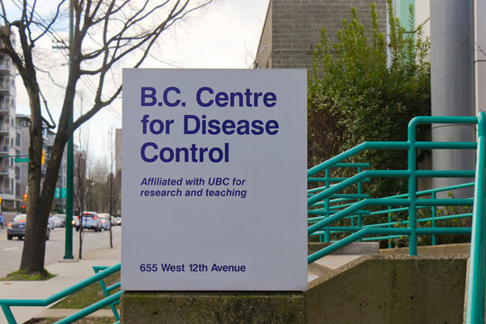 B.C. Centre for Disease Control sign at 655 West 12th Avenue noting UBC affiliation with teal accessibility ramps