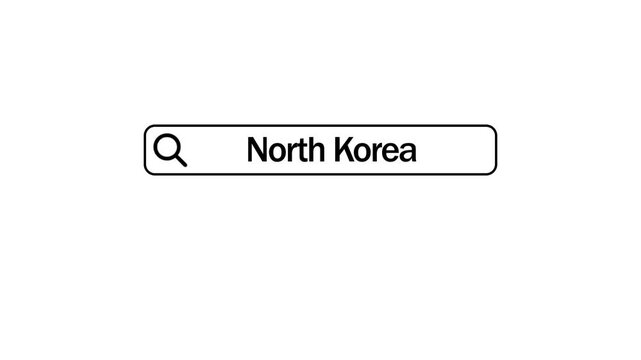 A search bar displaying the text North Korea with a magnifying glass on a plain white background representing internet search and geopolitical information