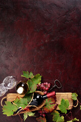 Fototapeta premium Red Wine Still Life with Grapes and Rustic Wooden Board