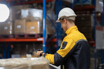 Man warehouse worker scanning barcode on package using handheld device, inventory control and stock management in logistics warehouse, industrial operation, supply chain and distribution concept © eakgrungenerd