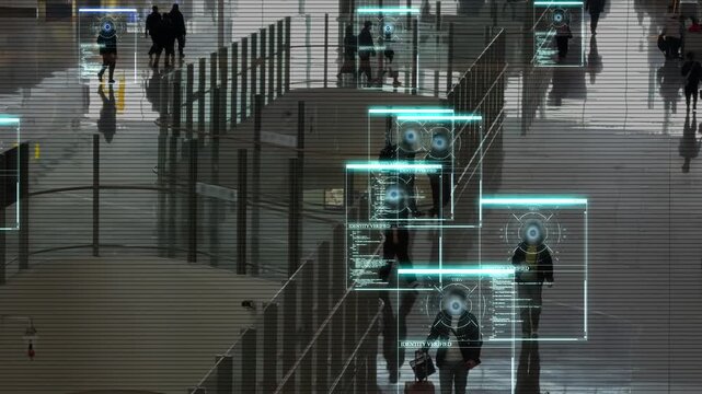 System recognizes faces in a crowd. The interface of an autonomous futuristic tracking software for moving people. Biometric identification and real-time scanning of multiple people. 4k footage.