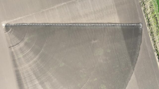 Aerial View of Pivot Irrigation System Watering Fertile Farmland. Modern Agriculture Technology for Sustainable Crop Growth and Soil Hydration