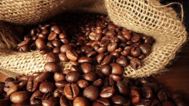 Close-Up of Roasted Coffee Beans Spilling from Burlap Sack. Aromatic, Rustic, and Organic Concept for Cafes, Coffee Packaging
