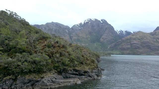 Calbuco chile patagonia river lake nature mountain trees clouds winter dusk morning drone