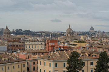Obraz premium Rome skyline from Capitoline Hill with Italian pine trees and St Peter Basilica dome view