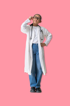 Young woman dressed as a doctor looks upward while touching her glasses thoughtful having an Idea, symbolizing thinking, problem-solving a medical or educational context