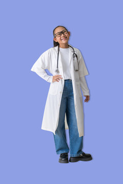 Confident Young Doctor with Friendly Smile dressed as a doctor stands confidently with hands on hips, representing trust, positivity