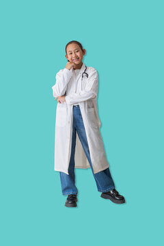 Cute young woman with smile dressed as a doctor poses with a thoughtful smile, representing confidence, kindness, and dreams of a future in healthcare