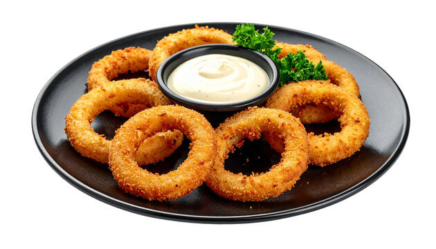 Fried onion rings with garlic aioli dipping sauce on black plate menu for restaurant, isolated on transparent background