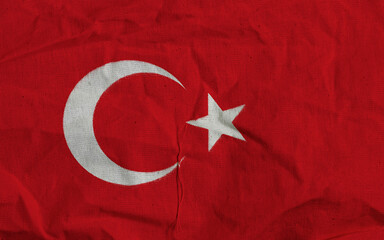 Obraz premium Turkish Flag On Textured Red Fabric With White Crescent And Star Symbol Close-Up