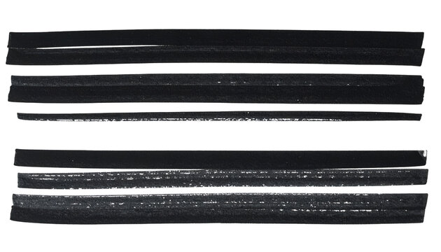 Close-up of layered dark rectangular shapes, possibly rubber or similar material