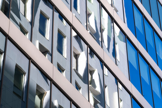 Glass office facade detail in Oslo Norway with modern window grid and architectural pattern creating an abstract urban texture