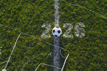 Green grass texture with a soccer ball in soccer stadium.