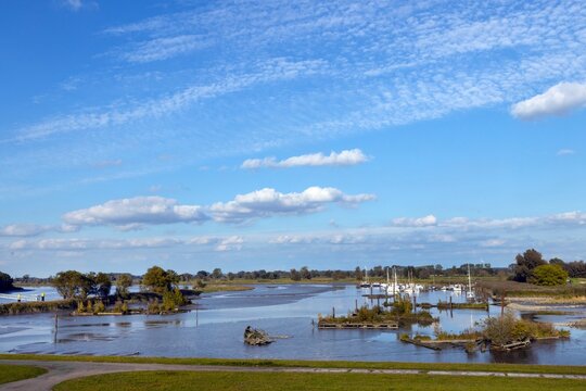 The river Elbe and flood plains at Sleeswijk Holstein near Gluckstadt. North Frisia. Yacht harbour. East Friesland. Nothern Germany.