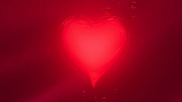 Glowing red heart shape surrounded by bubbles on a deep red background. Symbolizes love, passion, and romance in visual storytelling