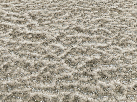 Aerial view of a cracked earth landscape revealing intricate patterns and textures under the harsh sun, Walvis Bay, Erongo Region, Namibia.