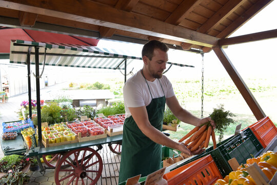 farmer sells fruit and vegetables from his own cultivation fresh from the field and from the greenhouse