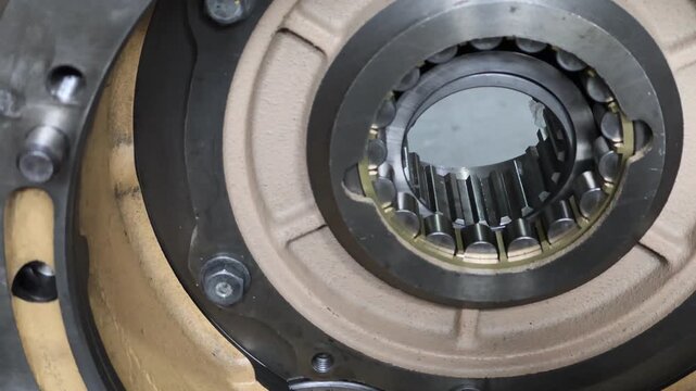 Heavy-duty cylindrical roller bearing installed in a planetary gear carrier of an transmission. Precision mechanical component for industrial drivetrain and heavy equipment repair.