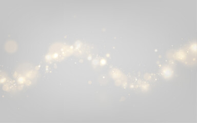 Glitter gold particles drift across dark background. Soft glowing bokeh lights enhance festive mood. Luxury design overlay PNG. © Extrastock