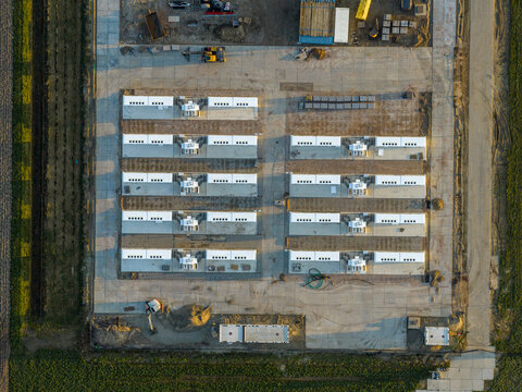 Aerial view of energy storage units construction at power plant facility
