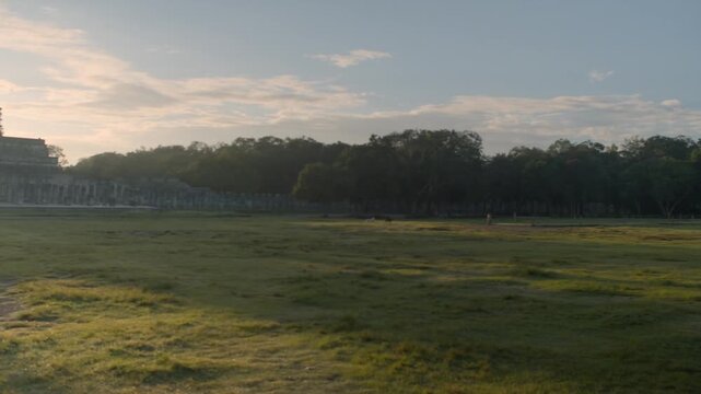 Early morning fog clearing away to reveal the famous mayan pyramid of Kukulcan in Chichen Itza