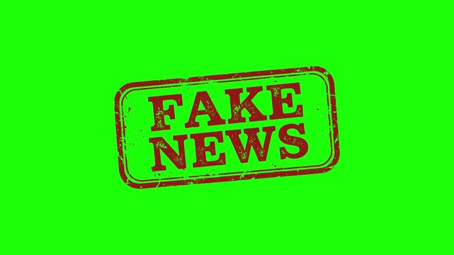 Red stamp with fake news text on green background
