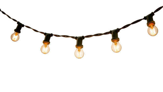 Isolated glowing vintage Edison light bulbs on a twisted wire string light strand