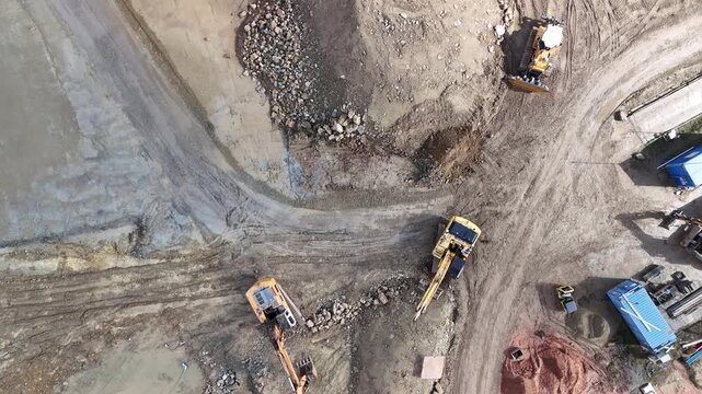 Aerial View of Construction Site with Excavators and Heavy Machinery