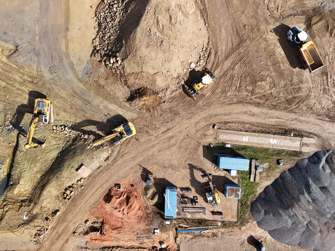 Aerial View of Construction Site with Excavators and Heavy Machinery