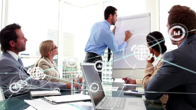 Presenter writing IDEAS on flipchart aligning business noting, network graphics growing over table