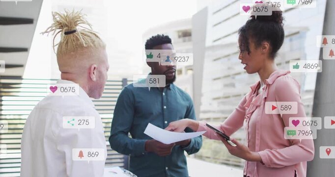 Right woman tapping tablet leading business team while icons growing over team checking results