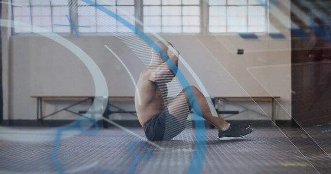 Mid-adult man starting sit-ups in gym, crunching for fitness with blue-white overlays crossing him