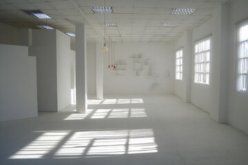 Empty contemporary white room with sunlight shadows
