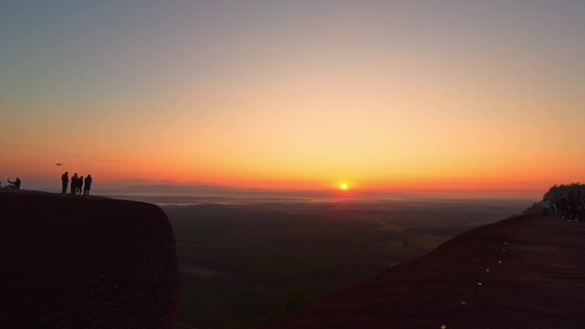 Bueng Kan, Thailand. 02 December 2025; Three Whale Rock Iconic Viewpoint of Northeastern Thailand. Epic sunrise at a famous Thai viewpoint, capturing tiny human figures on a colossal rock ledge