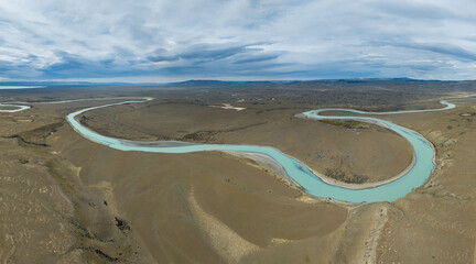 Aerial view over the endless Patagonian pampas with meandering river, southern Argentina © Chris