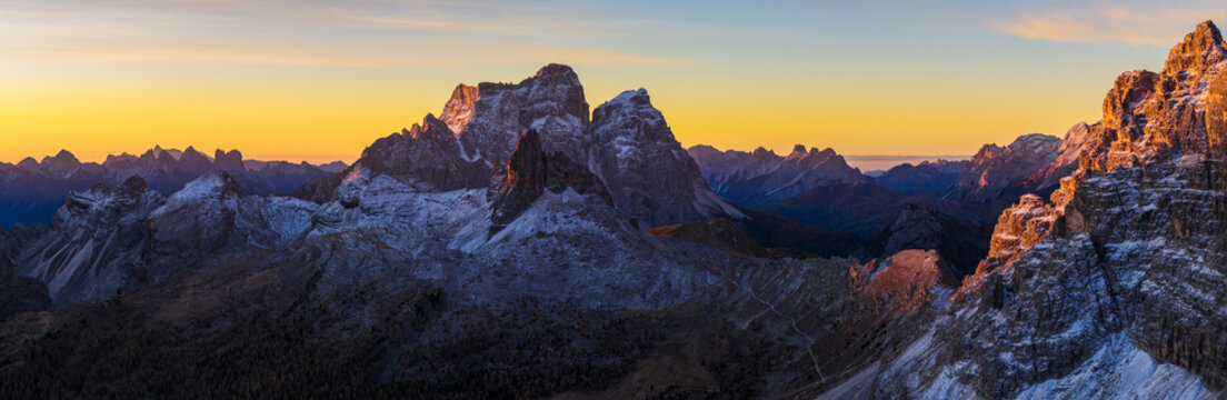 Panoramic aerial view of Monte Pelmo kissed by the golden dawn. Dolomiti Bellunesi, Veneto, Italy.