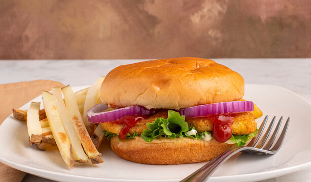 chicken nugget sandwich  with pickles and fries