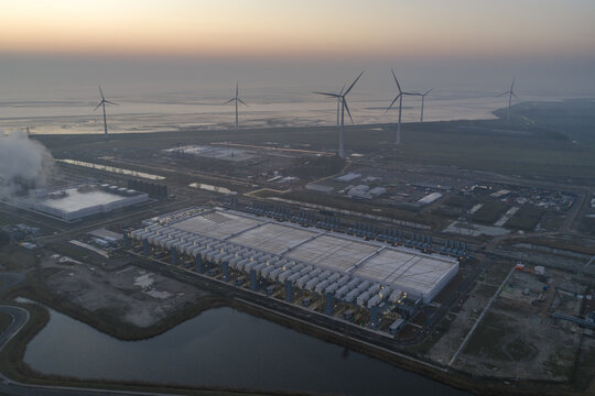 Aerial view of large data center campus in eemshaven, netherlands, utilizing wind power for cloud computing, ai, and digital infrastructure