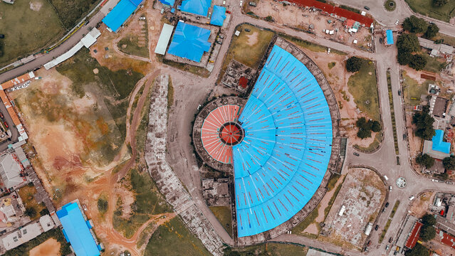 Aerial view of the striking contrast between the blue roof and the red roof of the building, Abuja, Nigeria.