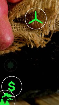 Vertical video: Camera shifting revealing burlap and tubers as neon icons settling for food ads