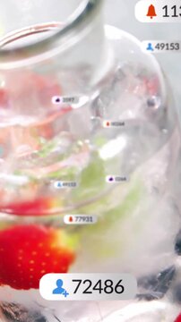 Vertical video: Camera tilting revealing clear jar and yellow bowl while UI badges growing fans